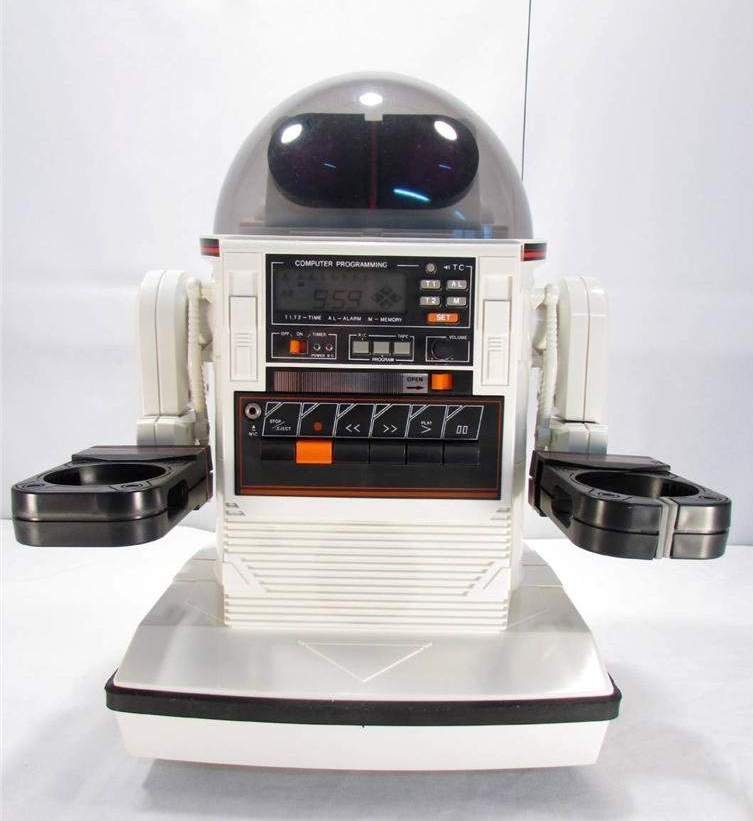 Figure 2 — A Tomy Omnibot 5402, showing the head, chest "COMPUTER PROGRAMMING"
panel, arms, and tray that a collector evaluates for completeness (reference only,
copyright source). Source: theoldro…